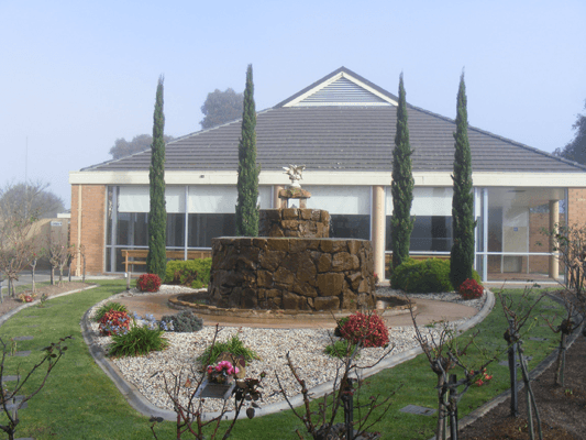 A memorial garden with a stone rotunda