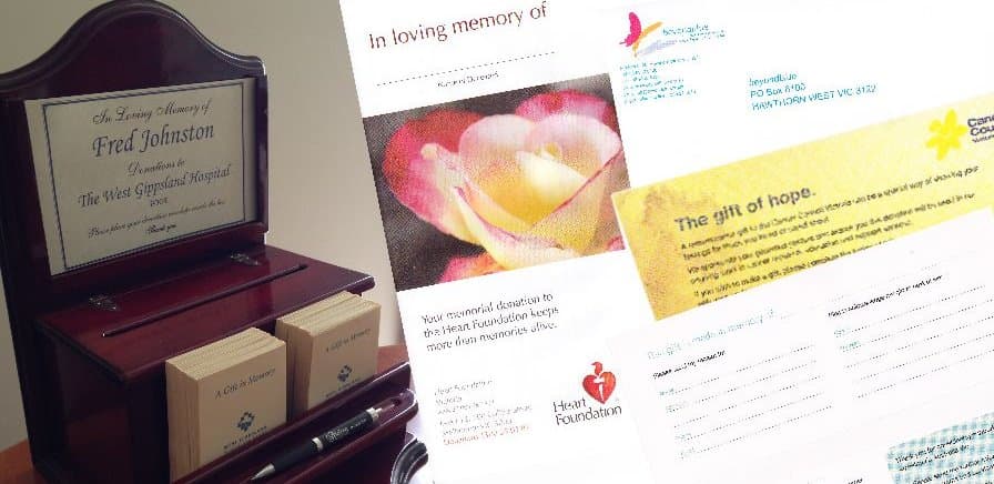 A memorial donation collection box and charity donation envelopes