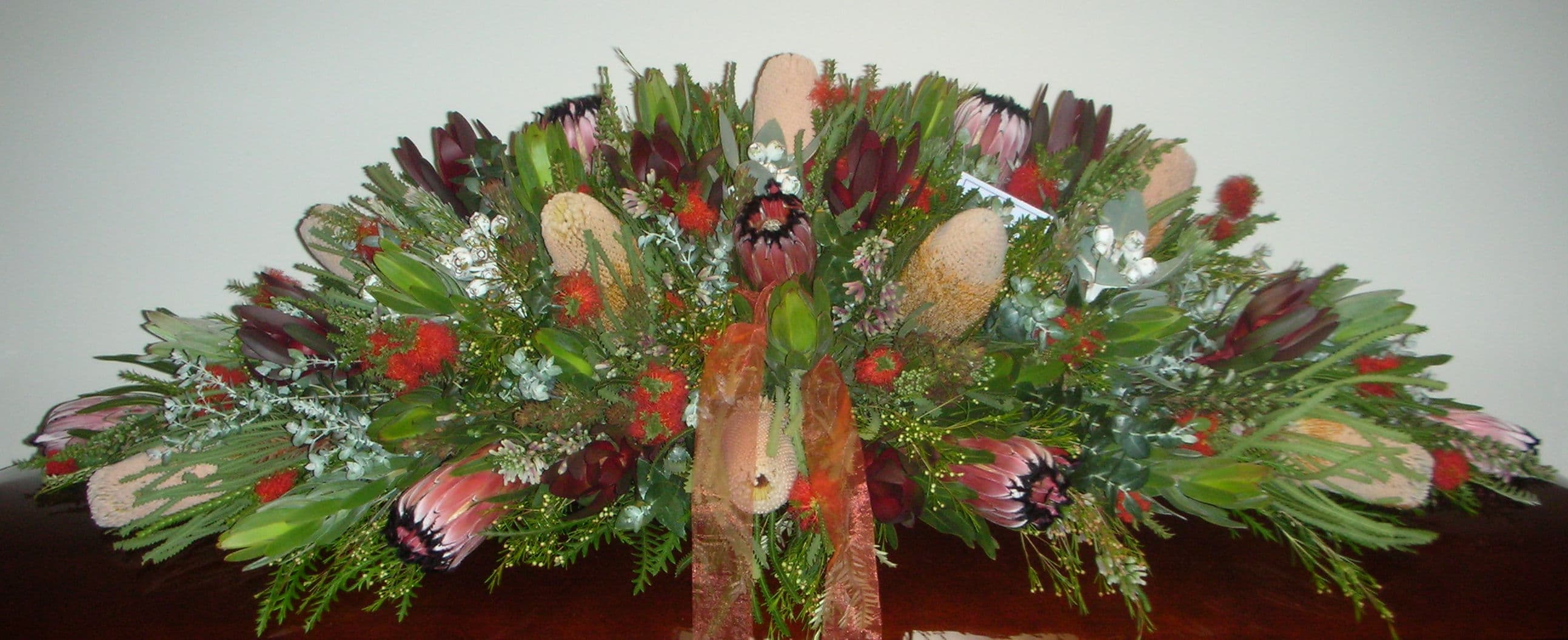 Native flower casket spray with proteas and banksias