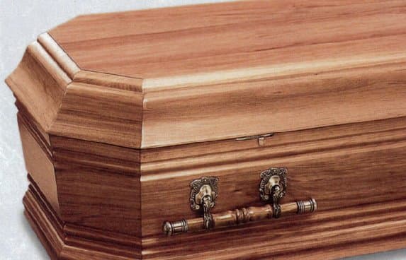 Close-up of a timber coffin with handles